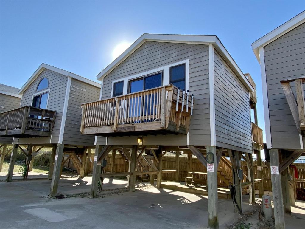 a house with two decks on stilts at NC 12 56821-10 Condo in Hatteras