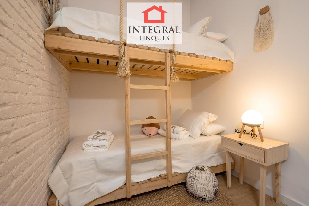 Posteľ alebo postele v izbe v ubytovaní Apartaments Ca la Somiada