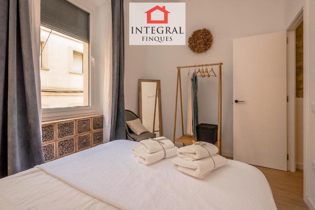 Posteľ alebo postele v izbe v ubytovaní Apartaments Ca la Somiada
