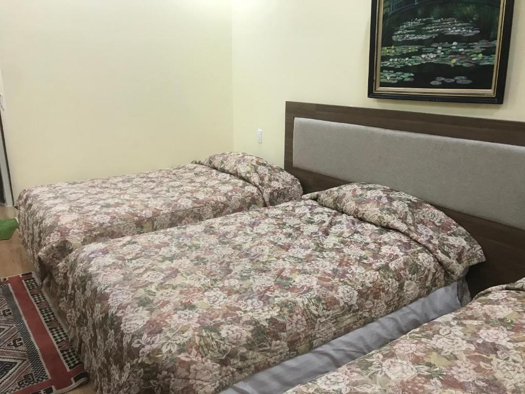 Postel nebo postele na pokoji v ubytování Ngoc Tran Hotel