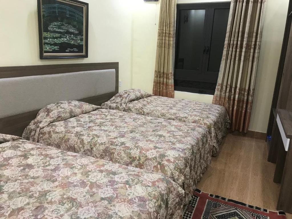 Postel nebo postele na pokoji v ubytování Ngoc Tran Hotel
