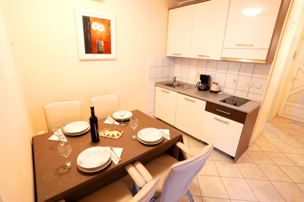 Kuchyň nebo kuchyňský kout v ubytování Beach Apartments Vlado