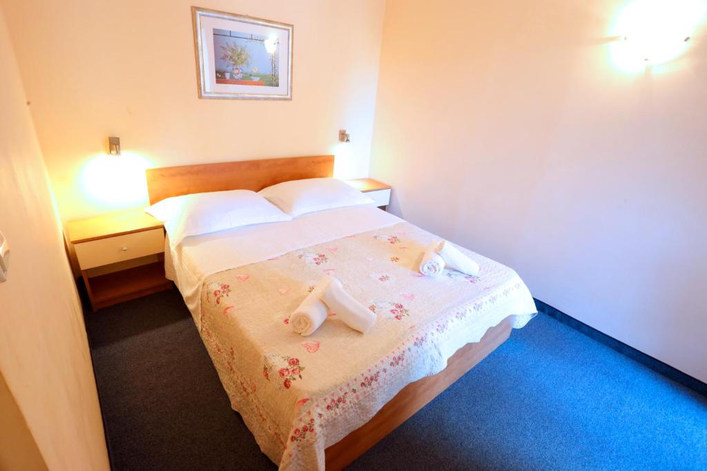 Postel nebo postele na pokoji v ubytování Beach Apartments Vlado