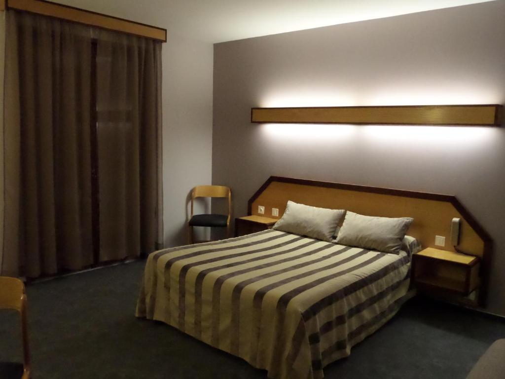 Postel nebo postele na pokoji v ubytování Hôtel le bastide