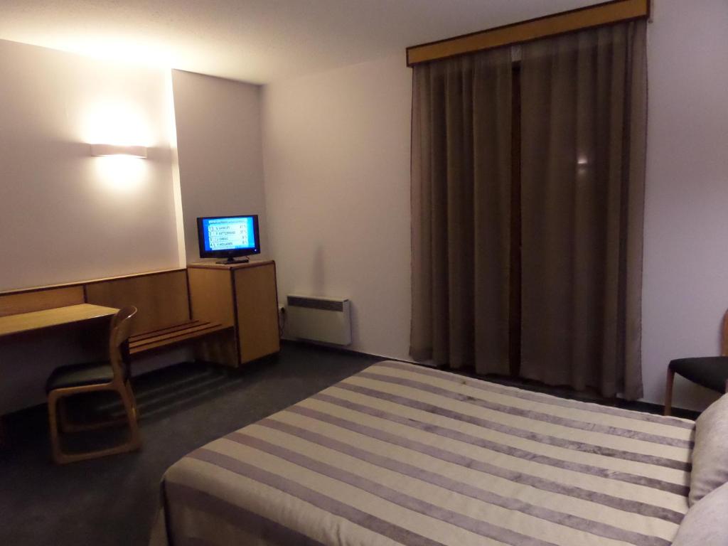 Postel nebo postele na pokoji v ubytování Hôtel le bastide