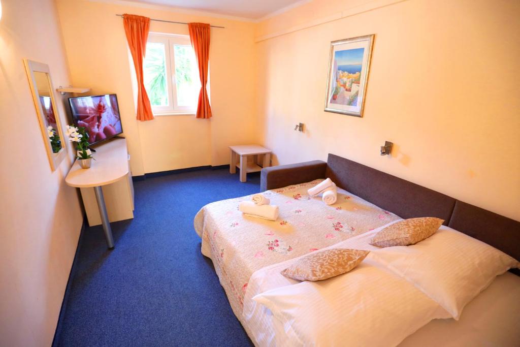 Postel nebo postele na pokoji v ubytování Beach Apartments Vlado