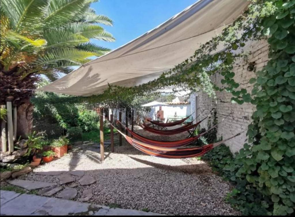 a hammock is tied to a building at Hostel Once Once in Villa de Leyva