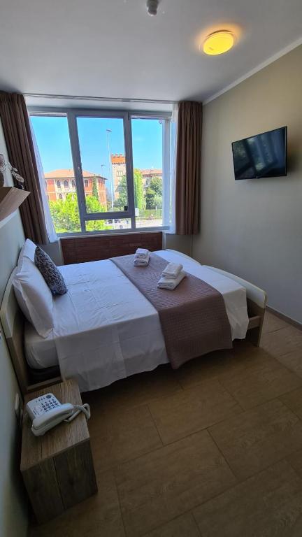 Postel nebo postele na pokoji v ubytování Atico Hotel