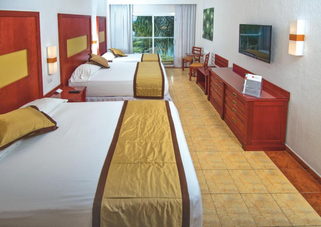 Postel nebo postele na pokoji v ubytování Riu Jalisco - All Inclusive