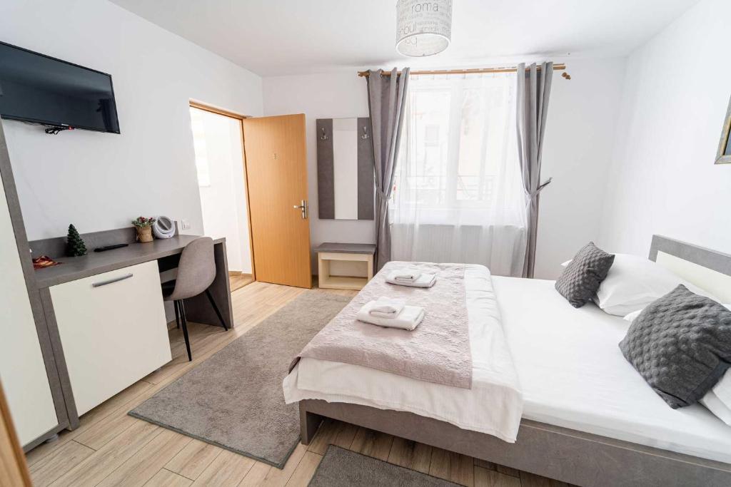 Postel nebo postele na pokoji v ubytování Casa Bucegi Busteni