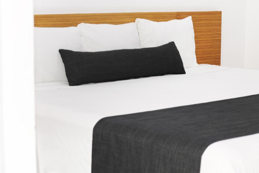 Postel nebo postele na pokoji v ubytování Nu Hotel