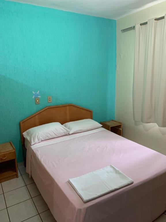 Ένα ή περισσότερα κρεβάτια σε δωμάτιο στο Flat Golden Thermas Residence