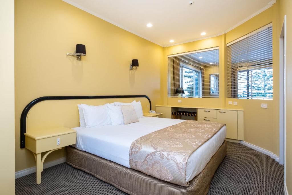 Postel nebo postele na pokoji v ubytování Motel de la Mer