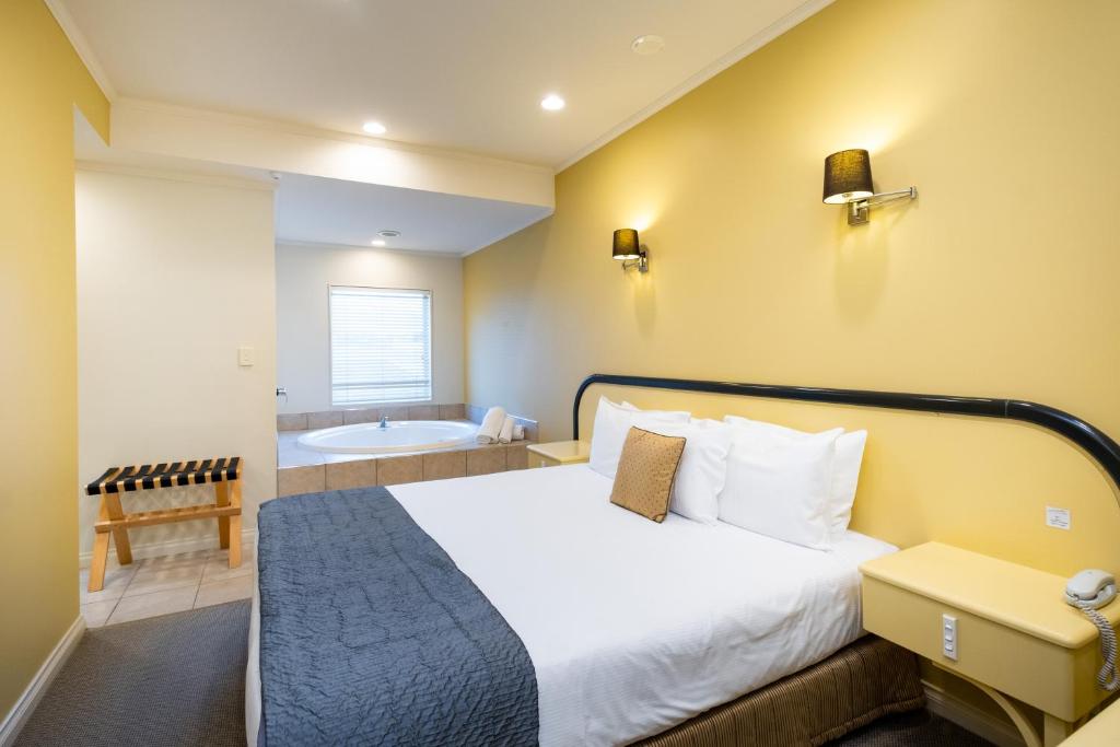 Postel nebo postele na pokoji v ubytování Motel de la Mer