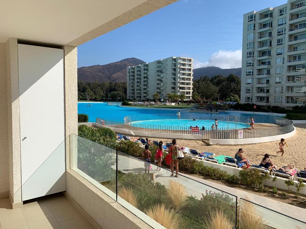 a view of a swimming pool from a building at Papudo Laguna in Papudo