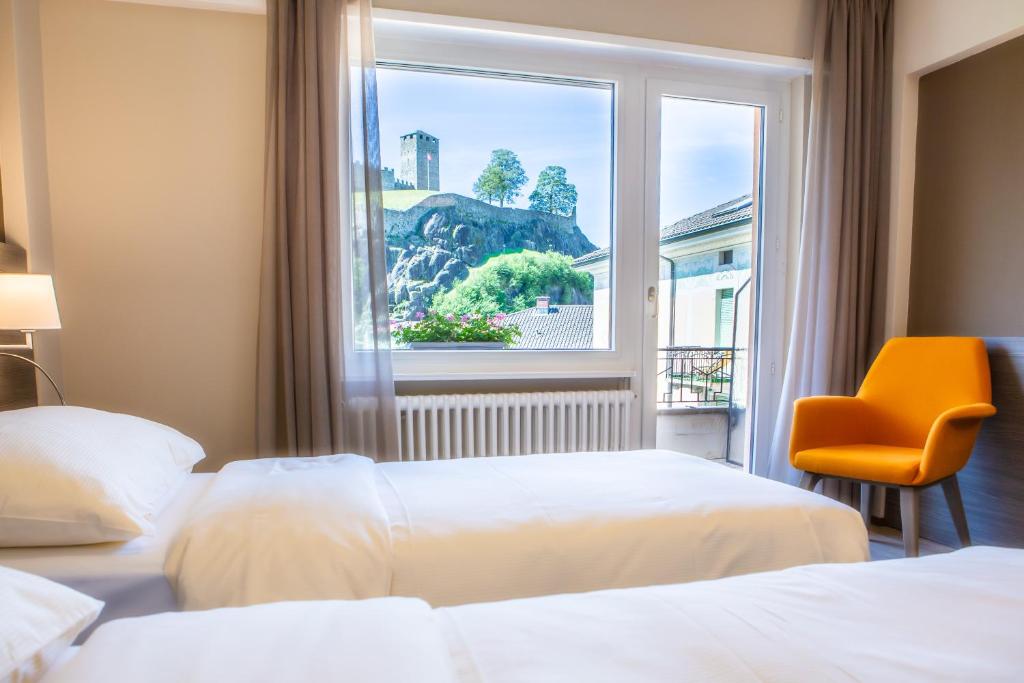 Postel nebo postele na pokoji v ubytování Hotel Unione