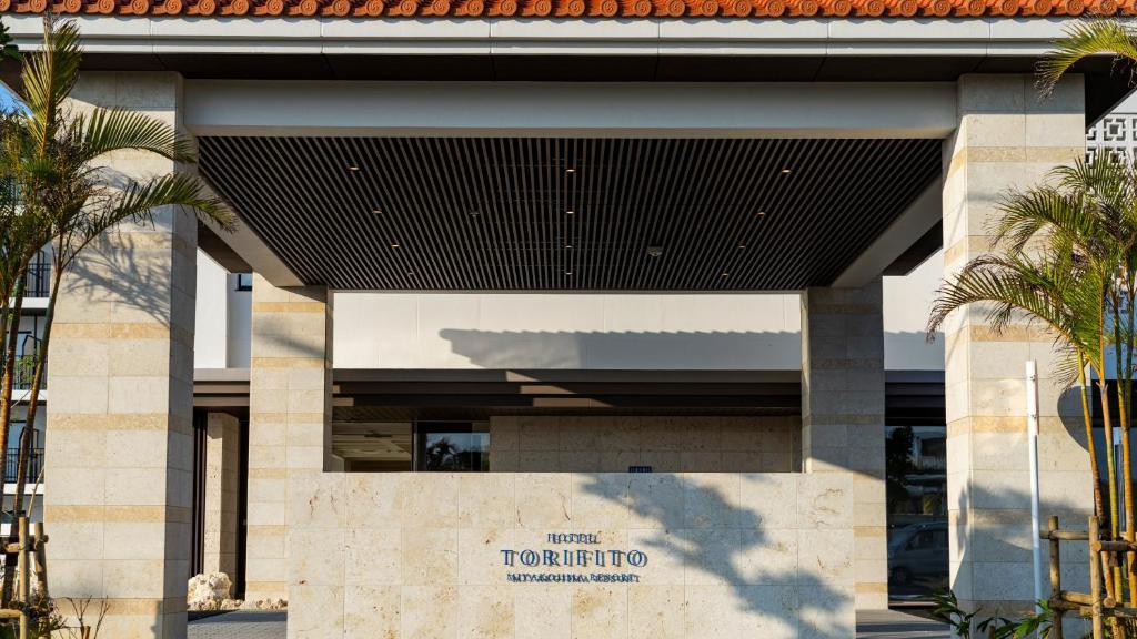 a building with a sign that reads toronto at Hotel Torifito Miyakojima Resort in Miyako-jima