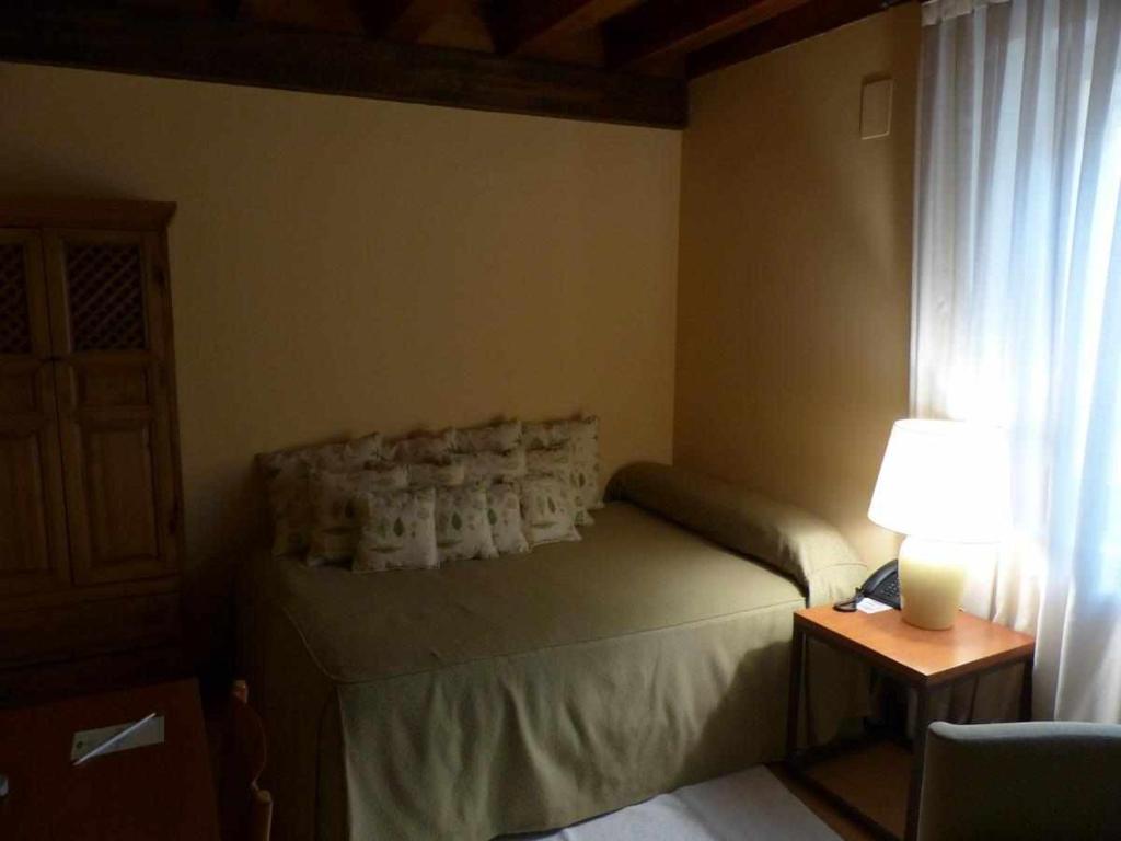 Postel nebo postele na pokoji v ubytování Hosteria del Arco