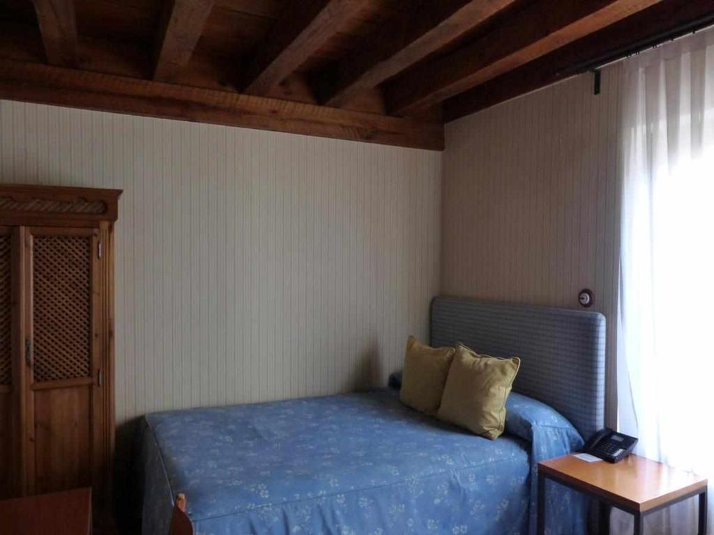 Postel nebo postele na pokoji v ubytování Hosteria del Arco