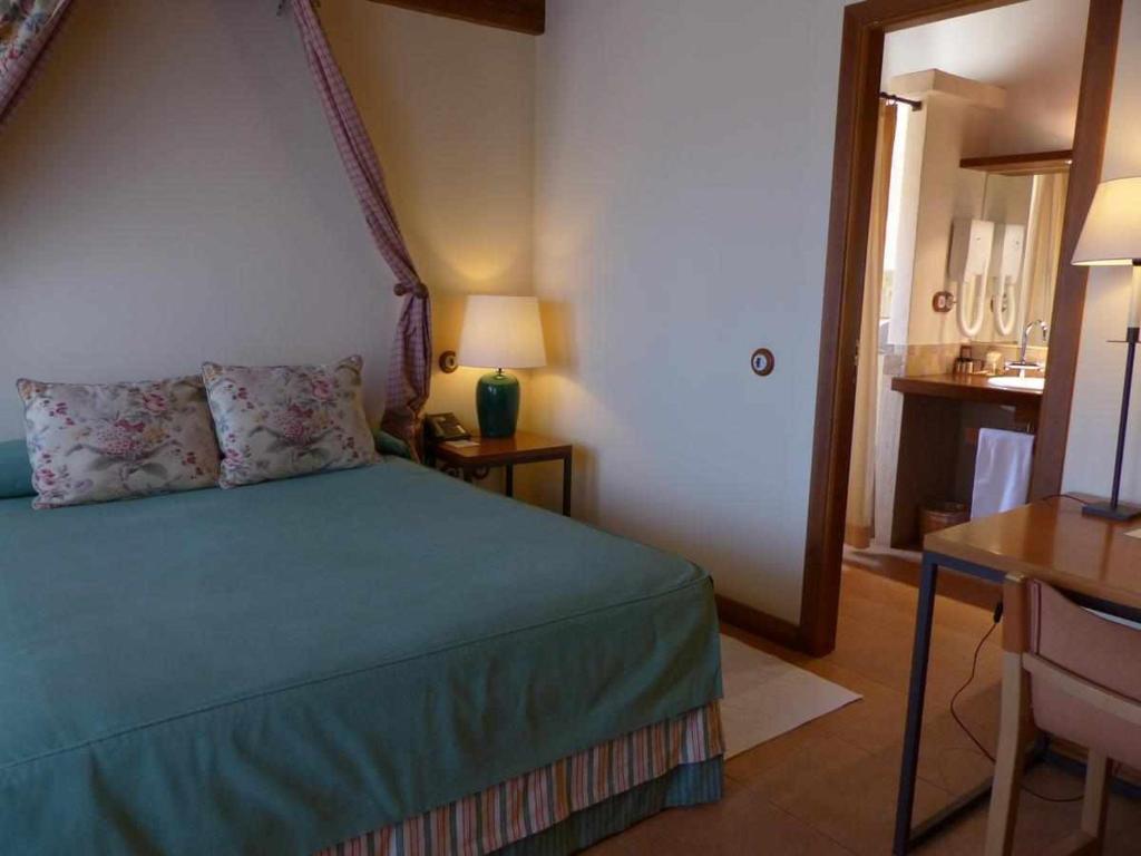 Postel nebo postele na pokoji v ubytování Hosteria del Arco