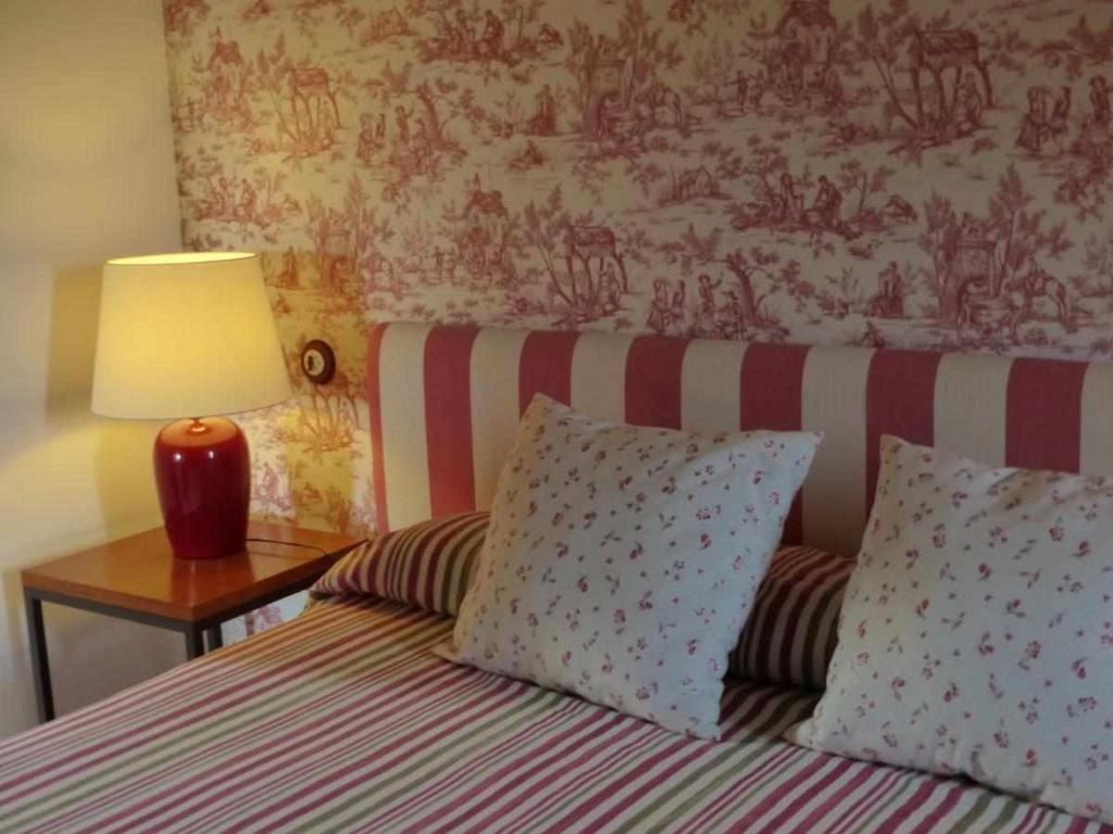Postel nebo postele na pokoji v ubytování Hosteria del Arco