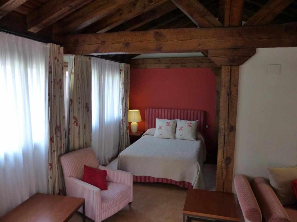 Postel nebo postele na pokoji v ubytování Hosteria del Arco