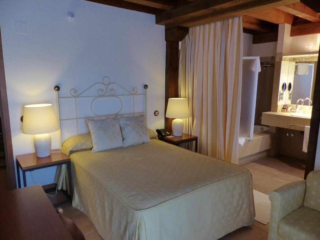 Postel nebo postele na pokoji v ubytování Hosteria del Arco