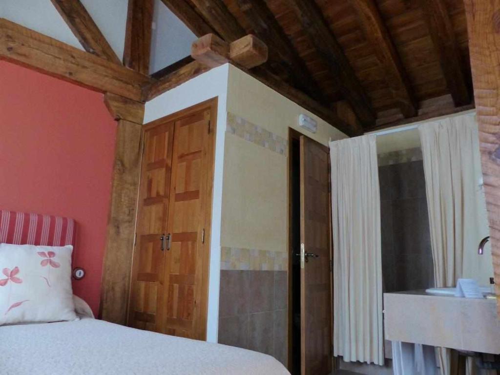 Postel nebo postele na pokoji v ubytování Hosteria del Arco