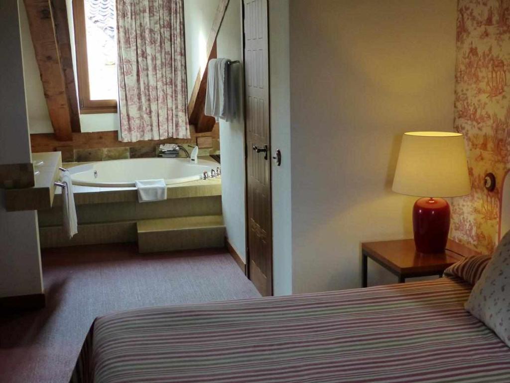 Postel nebo postele na pokoji v ubytování Hosteria del Arco