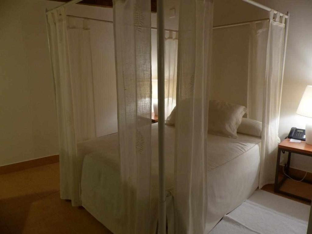 Postel nebo postele na pokoji v ubytování Hosteria del Arco