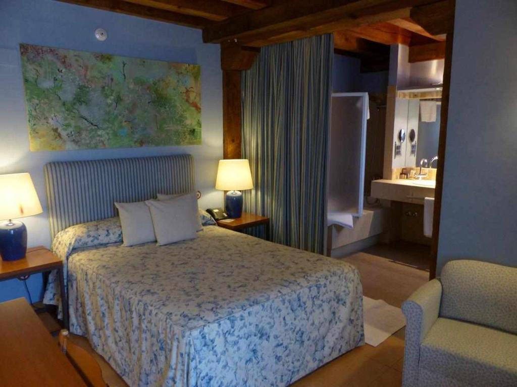 Postel nebo postele na pokoji v ubytování Hosteria del Arco