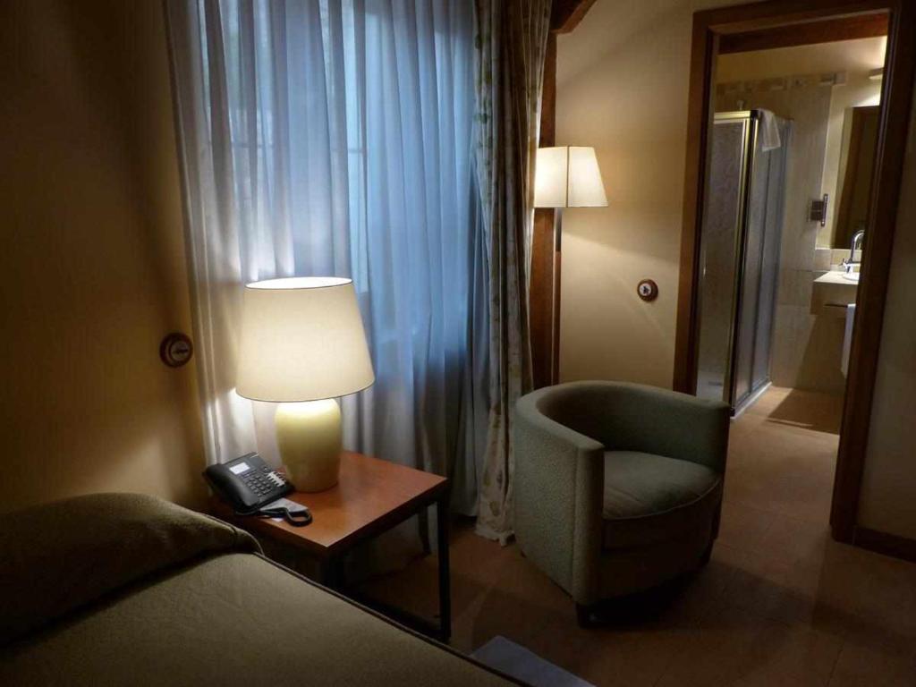 Postel nebo postele na pokoji v ubytování Hosteria del Arco