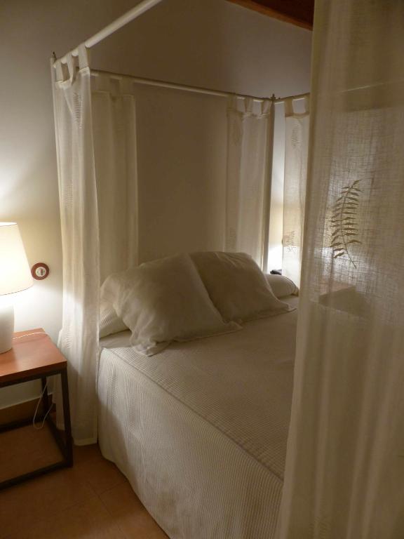 Postel nebo postele na pokoji v ubytování Hosteria del Arco