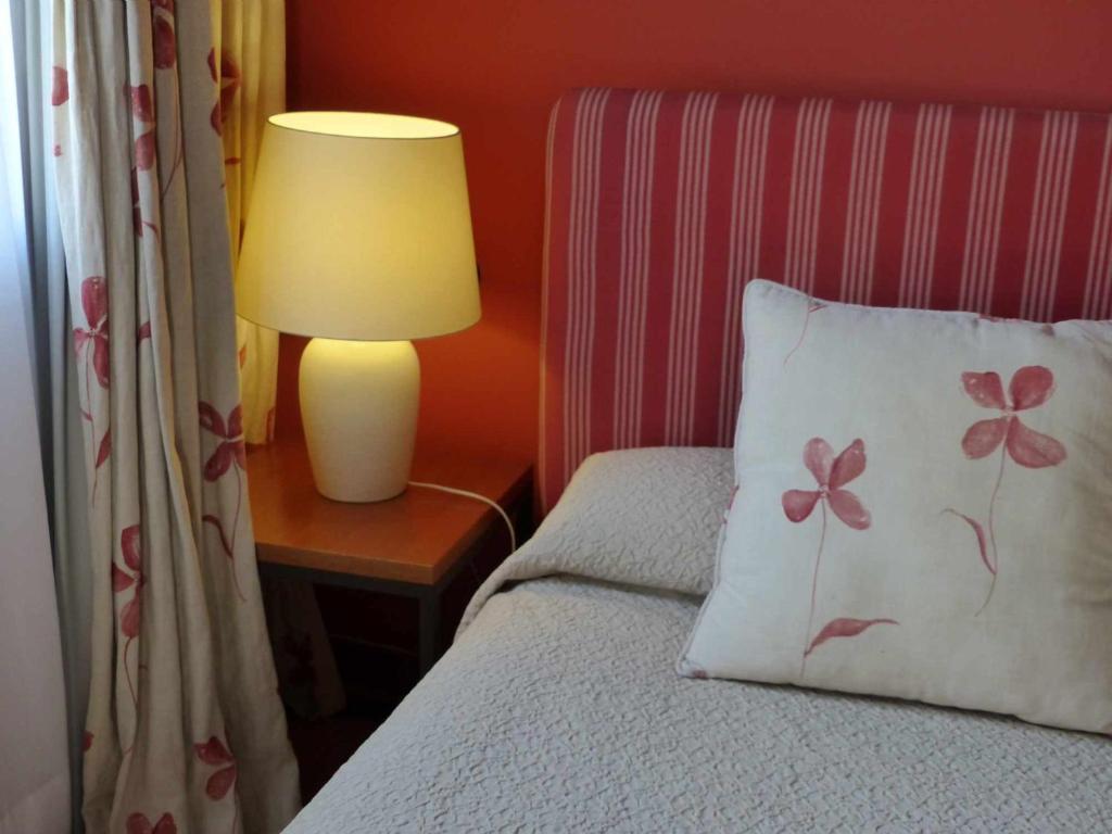 Postel nebo postele na pokoji v ubytování Hosteria del Arco