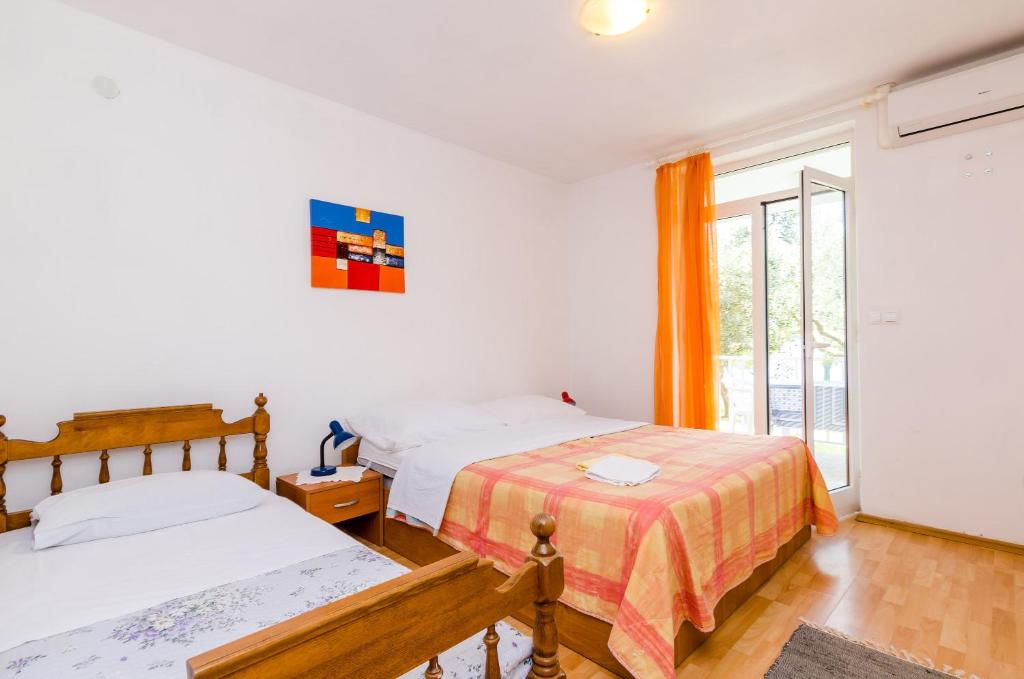 Posteľ alebo postele v izbe v ubytovaní Apartments Glavor