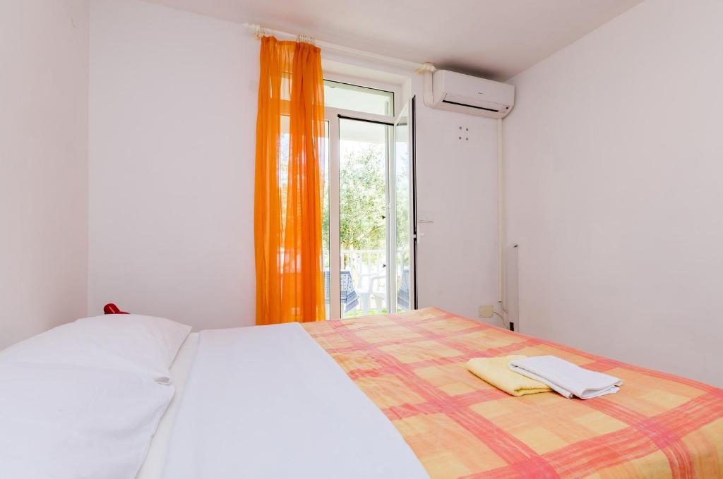 Posteľ alebo postele v izbe v ubytovaní Apartments Glavor
