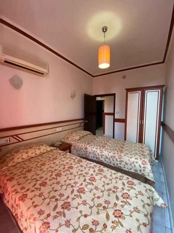 Postel nebo postele na pokoji v ubytování Lavinia Apart & Hotel