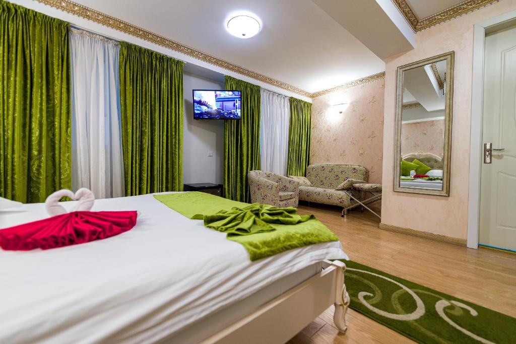 Postel nebo postele na pokoji v ubytování Hotel Helin Central