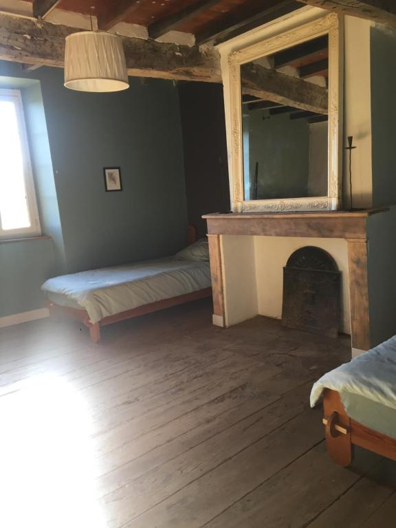 Postel nebo postele na pokoji v ubytování La Maison de Louis