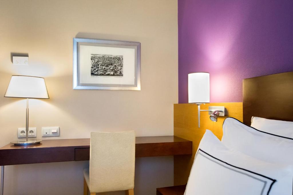 Posteľ alebo postele v izbe v ubytovaní Hotel Salamanca Montalvo