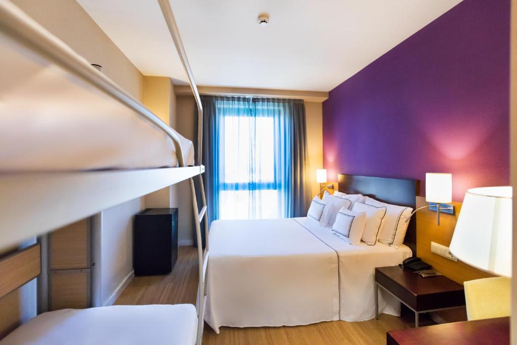 Posteľ alebo postele v izbe v ubytovaní Hotel Salamanca Montalvo