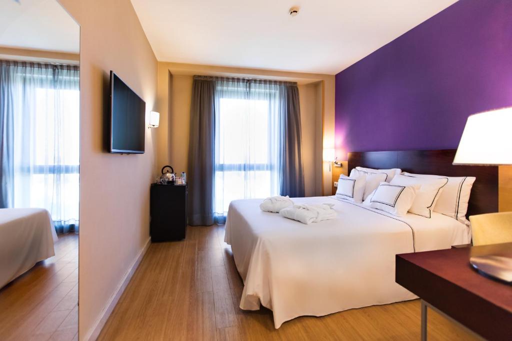 Posteľ alebo postele v izbe v ubytovaní Hotel Salamanca Montalvo