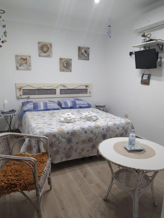 Postel nebo postele na pokoji v ubytování B&B Magna Grecia