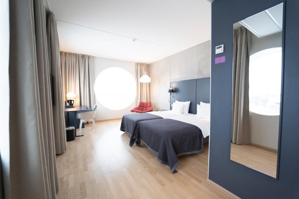 Postel nebo postele na pokoji v ubytování Quality Hotel Strawberry Arena