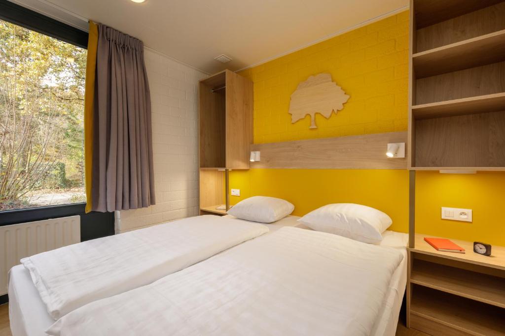 Postel nebo postele na pokoji v ubytování Center Parcs Erperheide