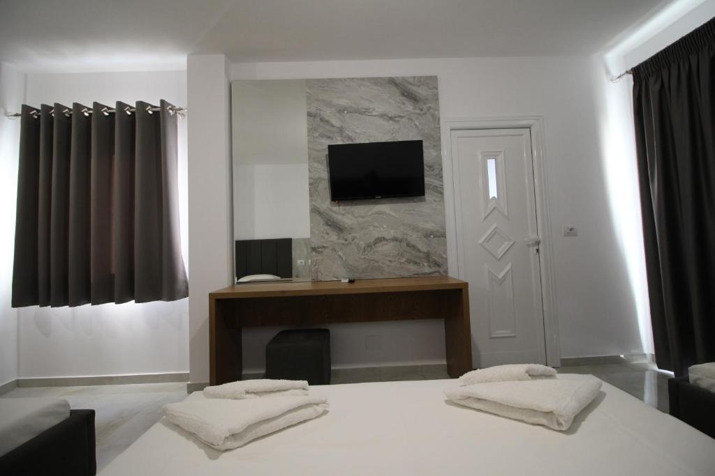TV a/nebo společenská místnost v ubytování Hotel Four Islands