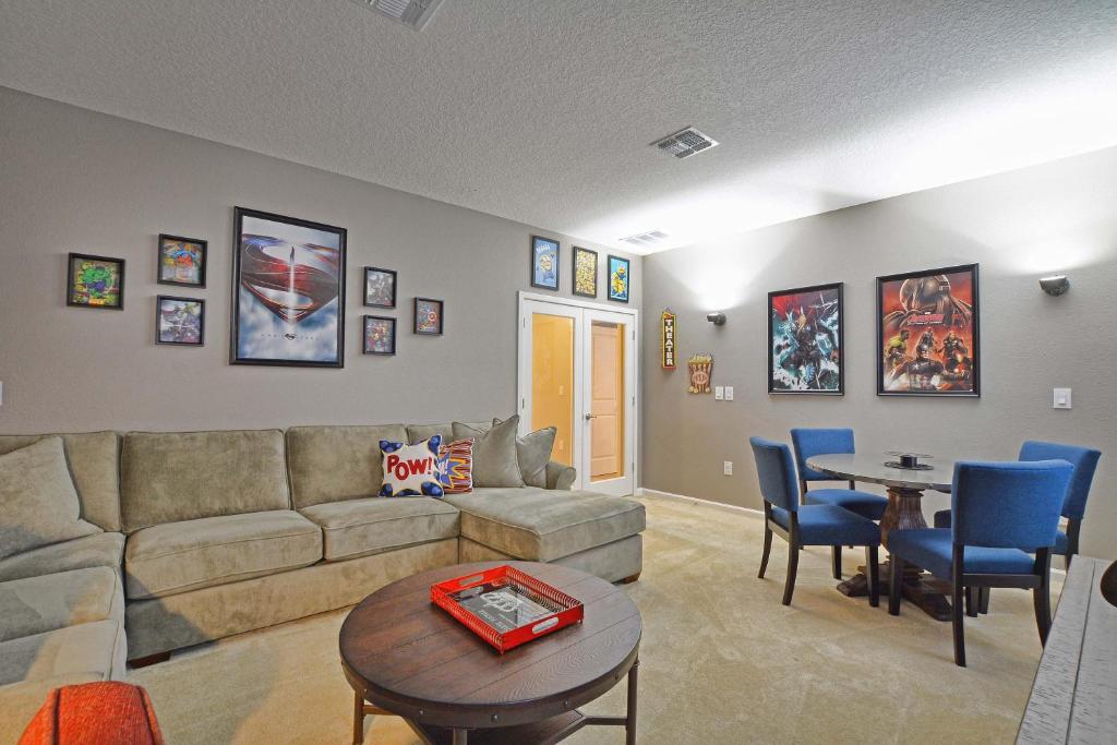 a living room with a couch and a table at Sonoma - 6 Bedroom Pool Home- 1856SN in Kissimmee