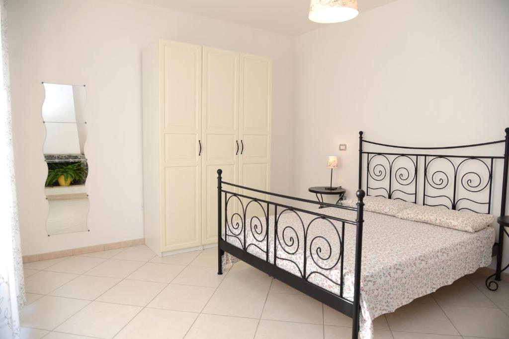 Postel nebo postele na pokoji v ubytování Jonico Guest House