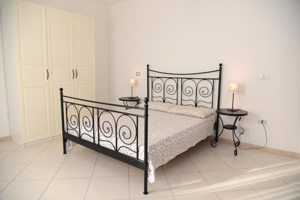Postel nebo postele na pokoji v ubytování Jonico Guest House
