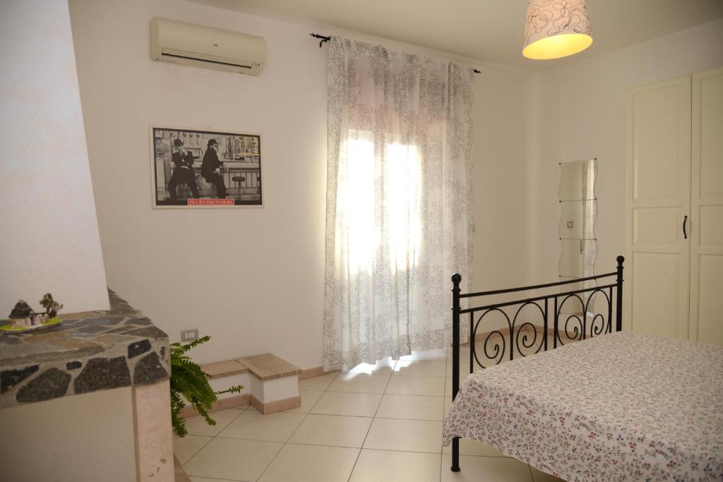 Postel nebo postele na pokoji v ubytování Jonico Guest House